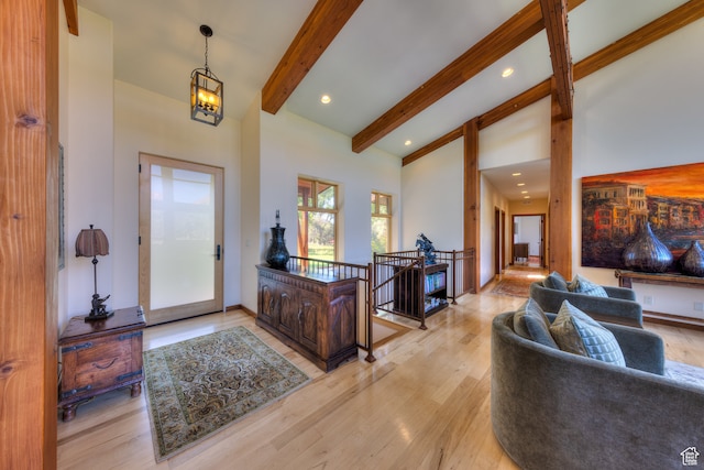425 Amber Ln, Castle Valley, UT 84532 - entrance foyer featuring beam ceiling, a chandelier, high vaulted ceiling, and light wood-type flooring