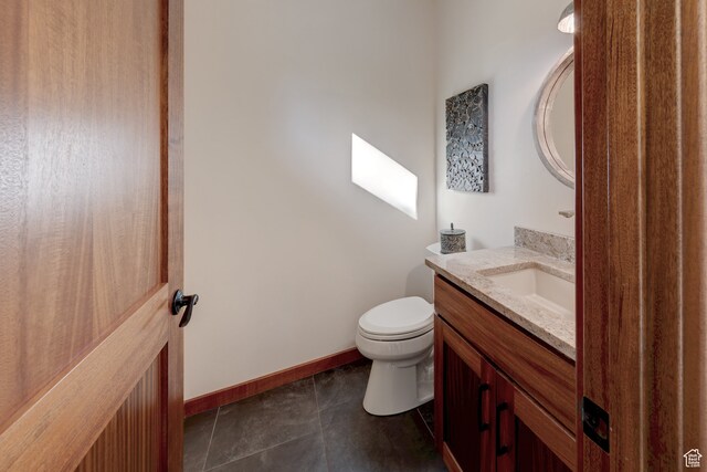 425 Amber Ln, Castle Valley, UT 84532 - bathroom featuring vanity, toilet, and tile patterned floors