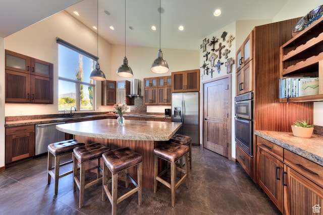 425 Amber Ln, Castle Valley, UT 84532 - kitchen featuring a breakfast bar, stainless steel appliances, sink, wall chimney exhaust hood, and a center island