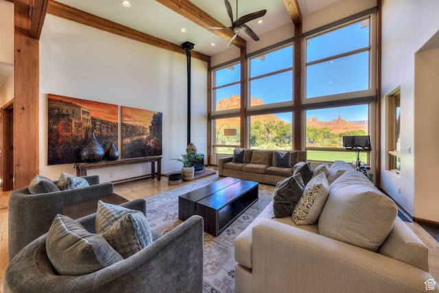 425 Amber Ln, Castle Valley, UT 84532 - living room with beam ceiling, a mountain view, a towering ceiling, light hardwood / wood-style floors, and ceiling fan