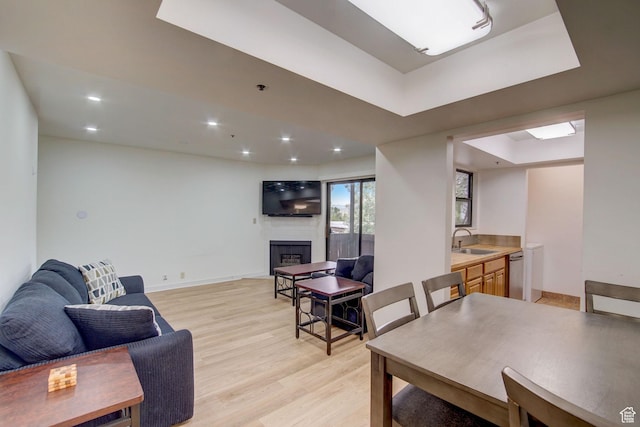 6861 N 2200 W Unit 9U, Park City, UT 84098 - dining area featuring recessed lighting, a raised ceiling, baseboards, light wood-style flooring, and a large fireplace