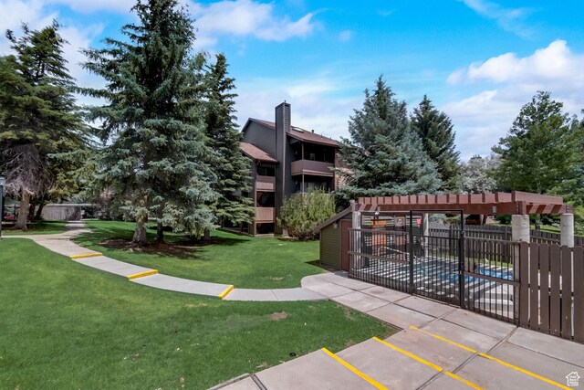 6861 N 2200 W Unit 9U, Park City, UT 84098 - view of community with a lawn, uncovered parking, and fence