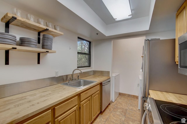 6861 N 2200 W Unit 9U, Park City, UT 84098 - kitchen featuring stainless steel appliances, open shelves, a tray ceiling, a sink, and wood counters