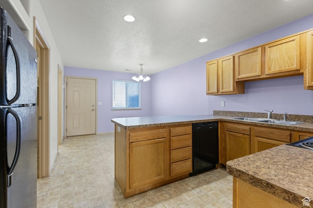 kitchen featuring a notable chandelier, a sink, a peninsula, black appliances, and recessed lighting