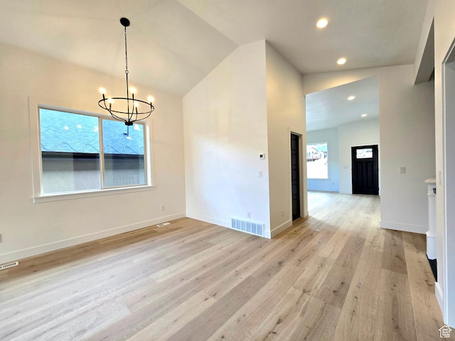 556 N Olympic Way Unit 38, Midway, UT 84049 - unfurnished dining area with a chandelier, light wood-style floors, recessed lighting, baseboards, and lofted ceiling