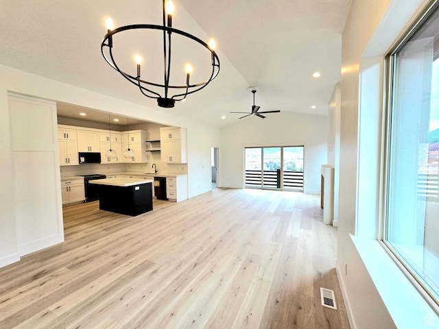 556 N Olympic Way Unit 38, Midway, UT 84049 - unfurnished living room featuring a sink, light wood finished floors, lofted ceiling, a chandelier, and ceiling fan