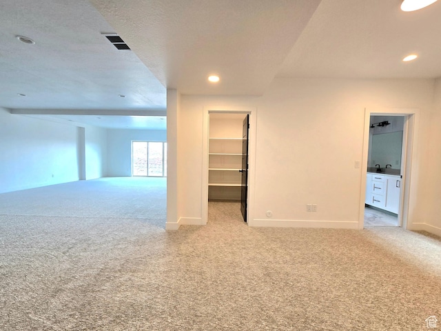 556 N Olympic Way Unit 38, Midway, UT 84049 - spare room featuring light colored carpet, baseboards, and recessed lighting