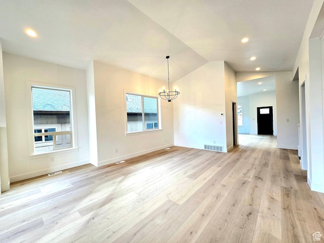 556 N Olympic Way Unit 38, Midway, UT 84049 - unfurnished dining area featuring a chandelier, light wood-style flooring, recessed lighting, vaulted ceiling, and baseboards