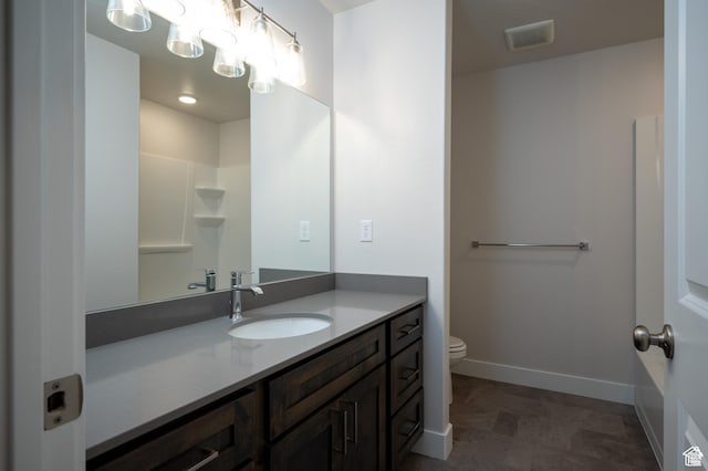 655 S 85 E Unit 32, Smithfield, UT 84335 - bathroom with toilet, vanity, and baseboards