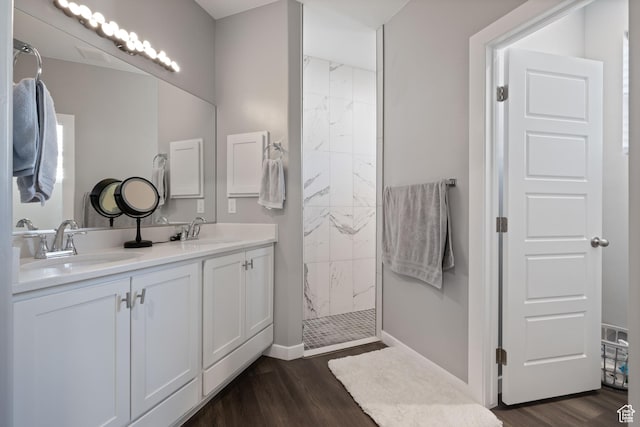 974 N Pleasant Valley Ln, Washington, UT 84780 - full bath featuring wood finished floors, a sink, and a walk in shower
