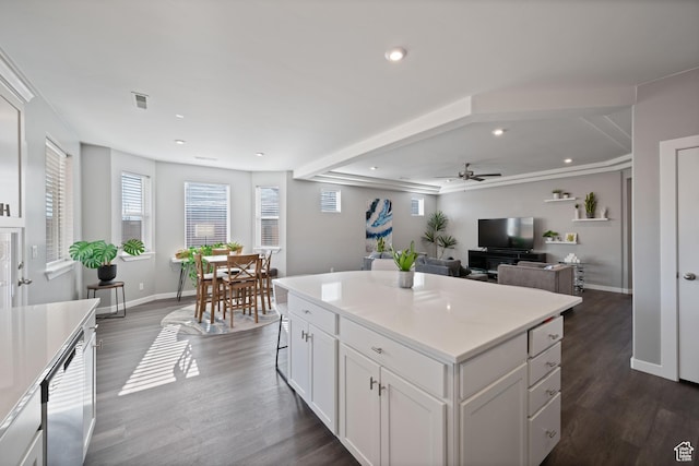 974 N Pleasant Valley Ln, Washington, UT 84780 - kitchen featuring dark wood-style flooring, visible vents, baseboards, white cabinetry, and a kitchen island