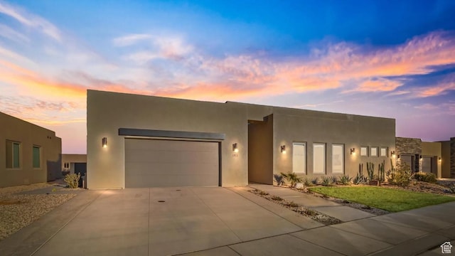 3193 S Hideaway Pl, Hurricane, UT 84737 - view of front of property featuring an attached garage, stucco siding, and driveway
