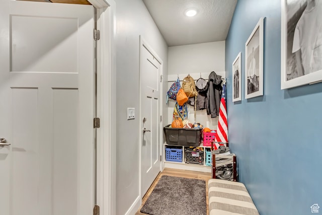 1441 E Snowflake Ave N, Eagle Mountain, UT 84005 - mudroom with hardwood / wood-style floors and a textured ceiling