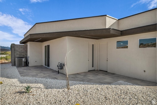 734 S 1220 W, Hurricane, UT 84737 - rear view of house featuring central air condition unit, a patio, and stucco siding