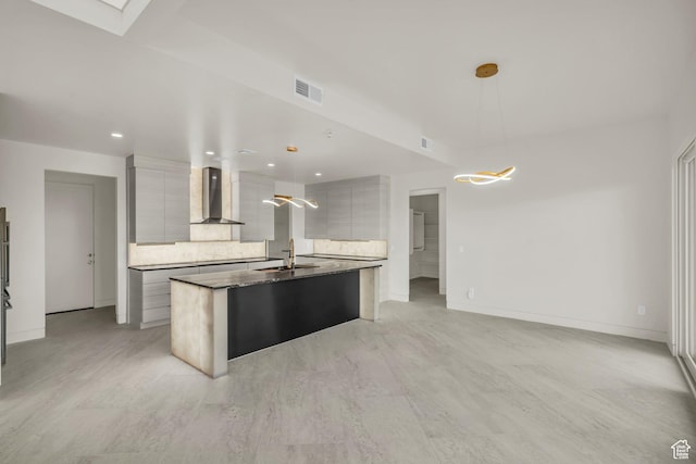 734 S 1220 W, Hurricane, UT 84737 - kitchen with wall chimney range hood, modern cabinets, a center island with sink, and visible vents