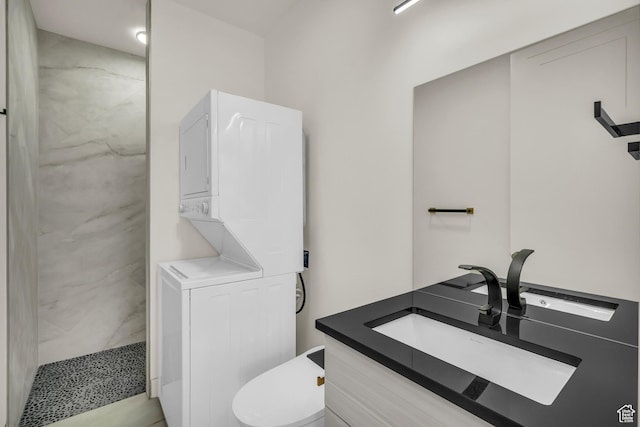 734 S 1220 W, Hurricane, UT 84737 - bathroom with toilet, stacked washer / drying machine, a marble finish shower, and vanity
