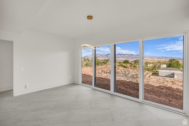 734 S 1220 W, Hurricane, UT 84737 - unfurnished dining area with baseboards and a mountain view