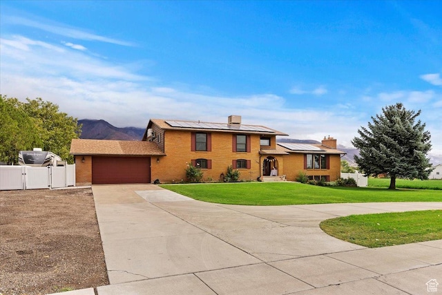 1286 N Fairfield E, Layton, UT 84040 - tri-level home featuring a garage, a front yard, and solar panels