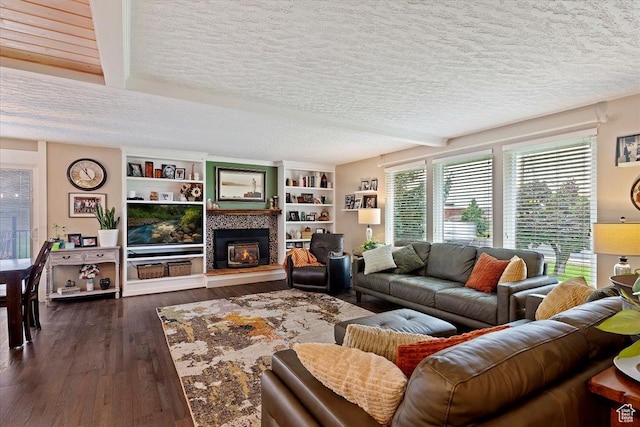 1286 N Fairfield E, Layton, UT 84040 - living room featuring a textured ceiling, dark hardwood / wood-style floors, beam ceiling, and a fireplace