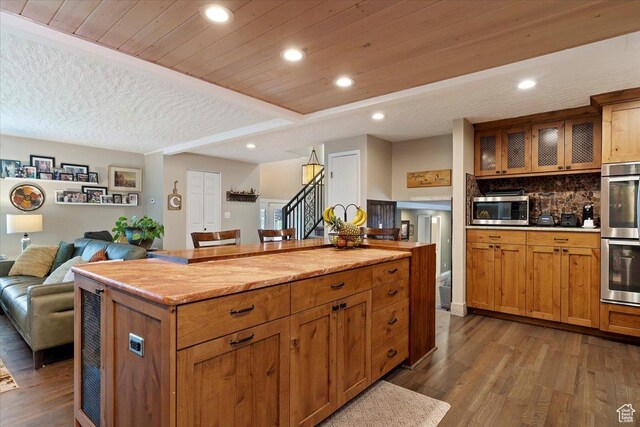 1286 N Fairfield E, Layton, UT 84040 - kitchen with a center island, wood-type flooring, decorative backsplash, appliances with stainless steel finishes, and wood ceiling
