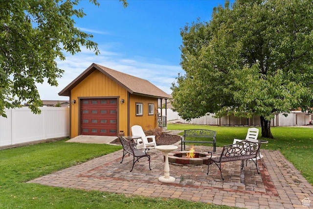 1286 N Fairfield E, Layton, UT 84040 - view of patio with an outbuilding, a garage, and an outdoor fire pit