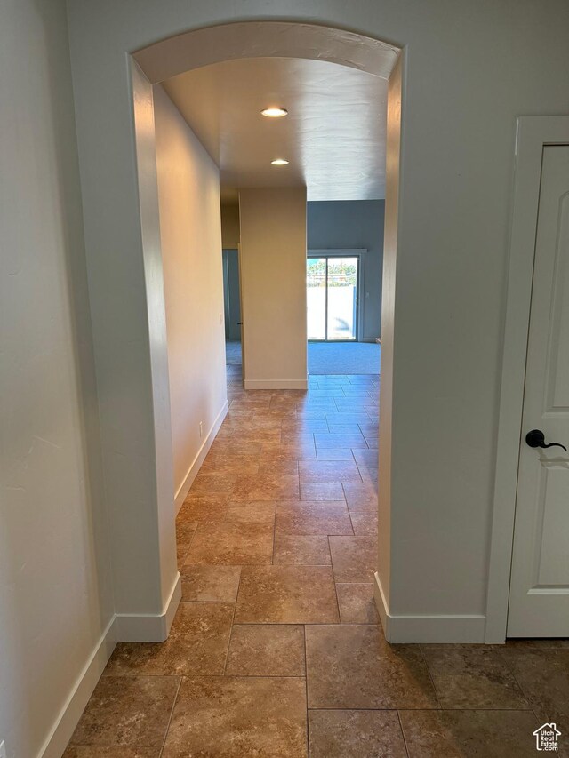 1260 N 200 W, Bountiful, UT 84010 - hallway with stone tile floors, arched walkways, baseboards, and recessed lighting