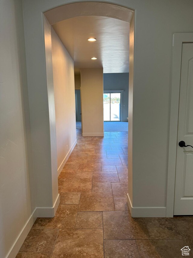 1260 N 200 W, Bountiful, UT 84010 - hall with recessed lighting, baseboards, arched walkways, and stone tile floors