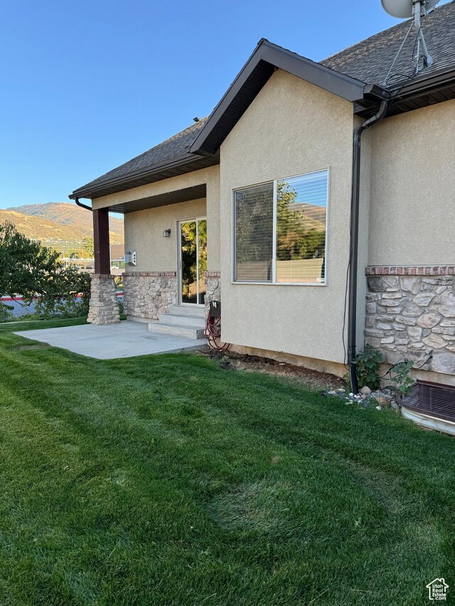 1260 N 200 W, Bountiful, UT 84010 - rear view of property with a lawn, stucco siding, entry steps, and stone siding