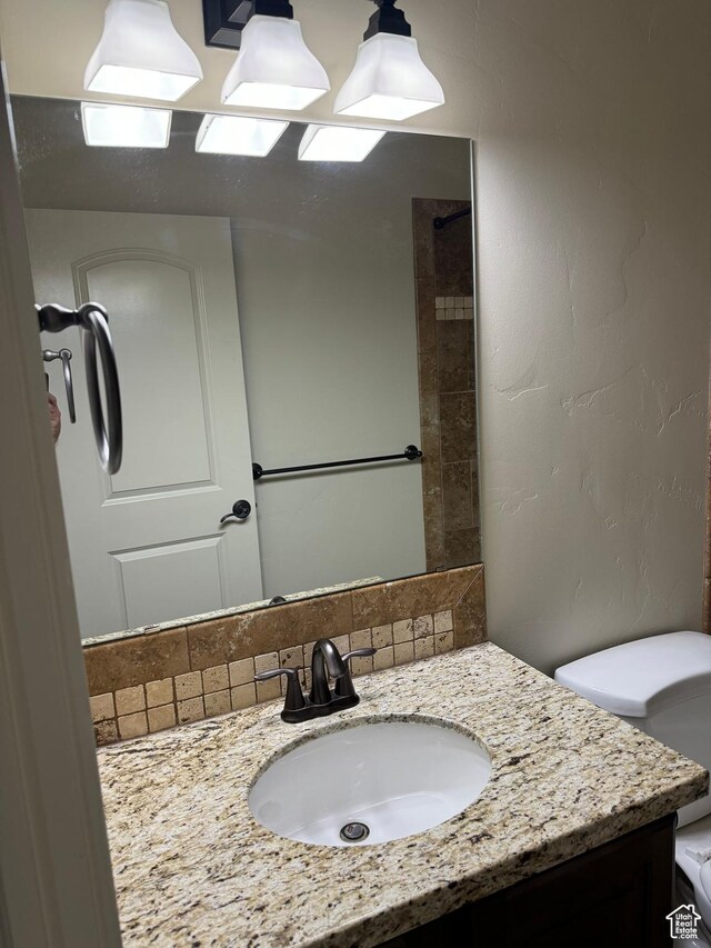 1260 N 200 W, Bountiful, UT 84010 - bathroom featuring vanity, tasteful backsplash, and toilet