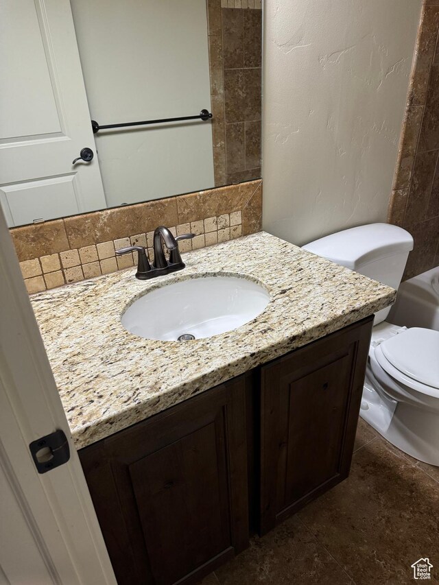 1260 N 200 W, Bountiful, UT 84010 - bathroom featuring toilet, decorative backsplash, and vanity