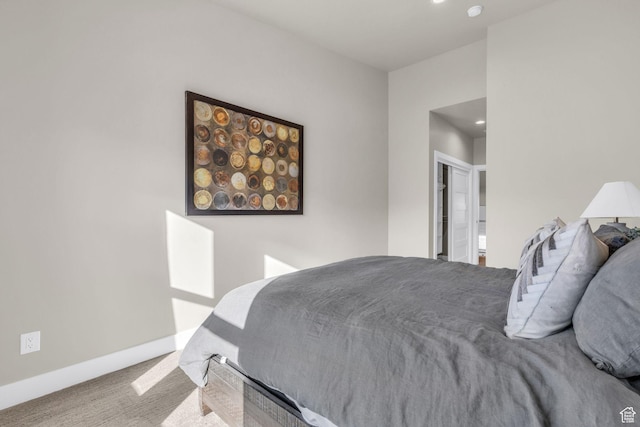 carpeted bedroom with baseboards