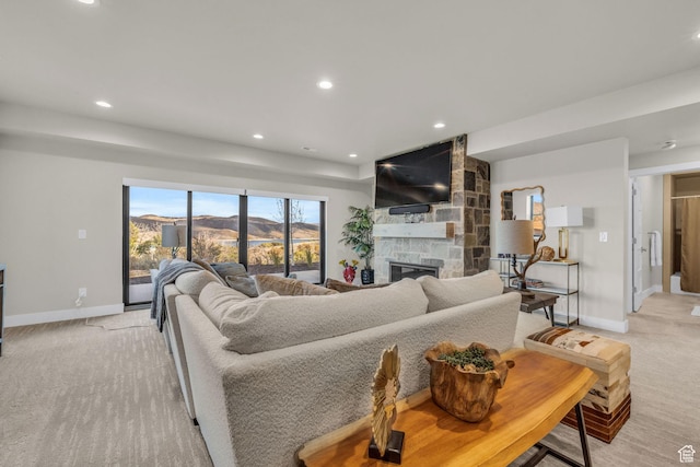 living room with recessed lighting, light carpet, and baseboards