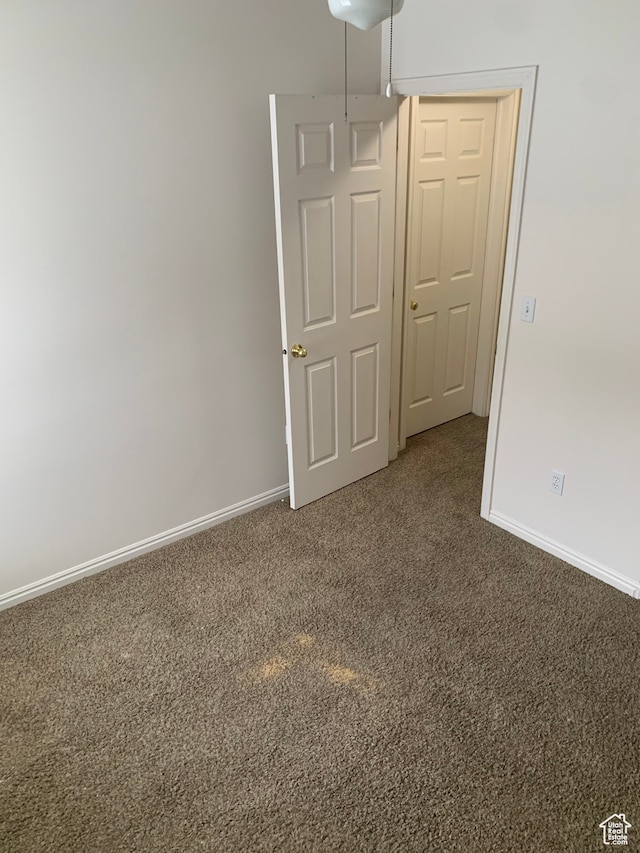 spare room featuring carpet floors
