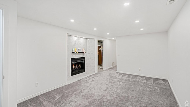 535 N 300 E, Brigham City, UT 84302 - unfurnished living room featuring a fireplace, baseboards, carpet, and recessed lighting