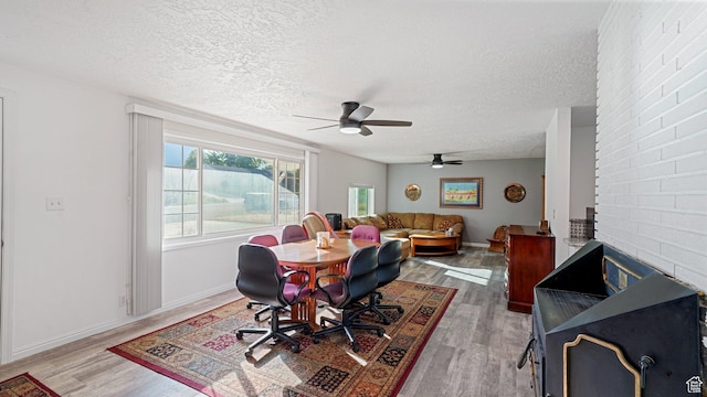 535 N 300 E, Brigham City, UT 84302 - dining space with baseboards, ceiling fan, a textured ceiling, and wood finished floors