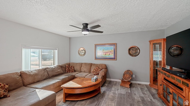 535 N 300 E, Brigham City, UT 84302 - living room featuring baseboards, a ceiling fan, a textured ceiling, and wood finished floors