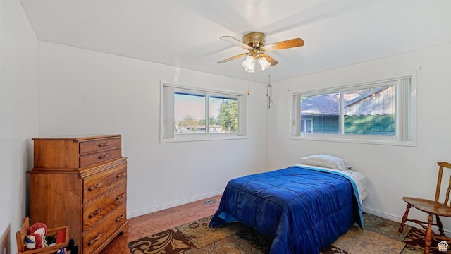 535 N 300 E, Brigham City, UT 84302 - bedroom featuring baseboards, ceiling fan, and wood finished floors