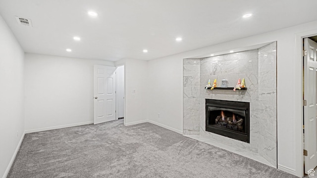 535 N 300 E, Brigham City, UT 84302 - unfurnished living room with recessed lighting, visible vents, carpet, and a high end fireplace