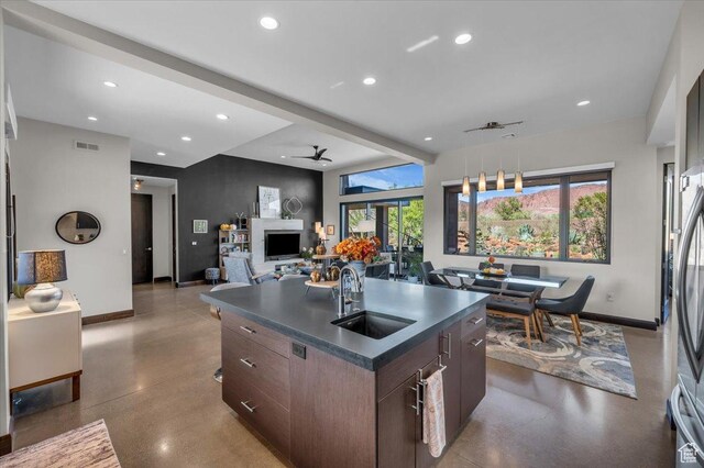 644 W Wild Indigo Way, Ivins, UT 84738 - kitchen with finished concrete floors, a sink, dark countertops, visible vents, and recessed lighting