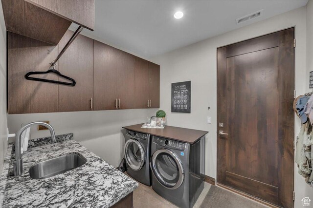 644 W Wild Indigo Way, Ivins, UT 84738 - laundry area with washing machine and clothes dryer, a sink, visible vents, recessed lighting, and cabinet space