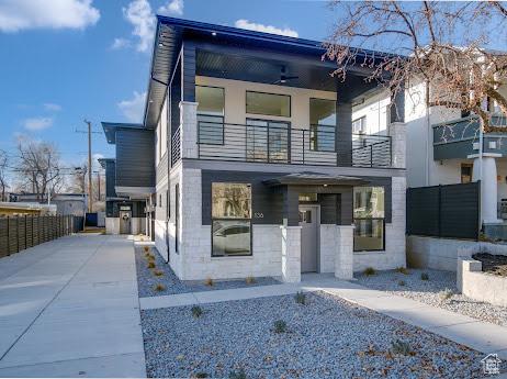 136 S 700 E Unit 1, Salt Lake City, UT 84102 - contemporary house featuring a balcony