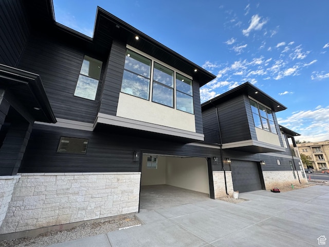 view of side of property with a garage