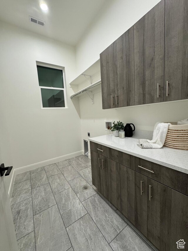136 S 700 E Unit 1, Salt Lake City, UT 84102 - laundry room featuring cabinets, hookup for a washing machine, and electric dryer hookup