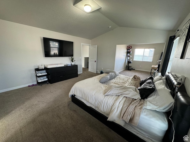 carpeted bedroom with lofted ceiling and baseboards