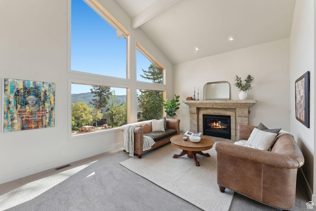 3797 Blacksmith Rd, Park City, UT 84098 - carpeted living area with a glass covered fireplace, high vaulted ceiling, beamed ceiling, and baseboards