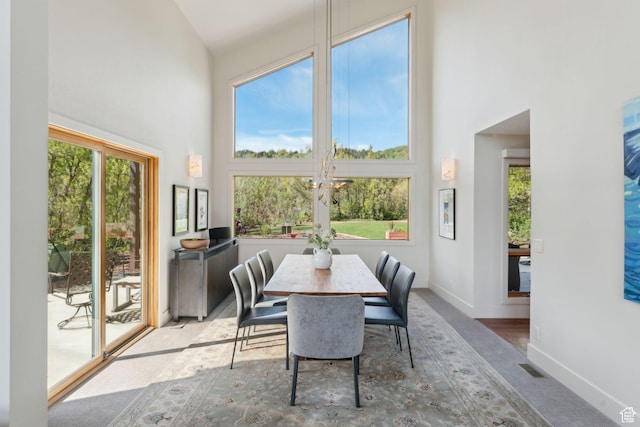 3797 Blacksmith Rd, Park City, UT 84098 - dining room featuring a high ceiling, baseboards, and carpet floors