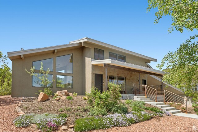 3797 Blacksmith Rd, Park City, UT 84098 - view of front of property with stucco siding and covered porch