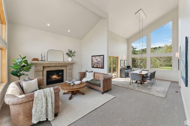 3797 Blacksmith Rd, Park City, UT 84098 - carpeted living area featuring a glass covered fireplace, high vaulted ceiling, and baseboards
