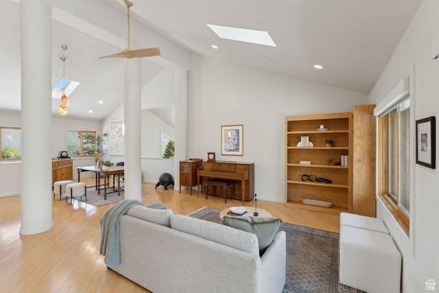 3797 Blacksmith Rd, Park City, UT 84098 - living room with a skylight, light wood-type flooring, high vaulted ceiling, recessed lighting, and baseboards