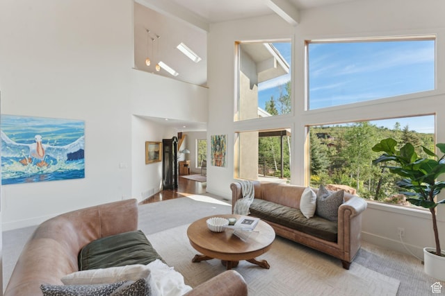 3797 Blacksmith Rd, Park City, UT 84098 - living room with a towering ceiling, baseboards, and beam ceiling